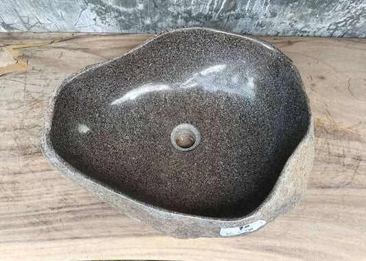 Top view of triangular river stone sink 6070-4940 with polished dark gray interior
