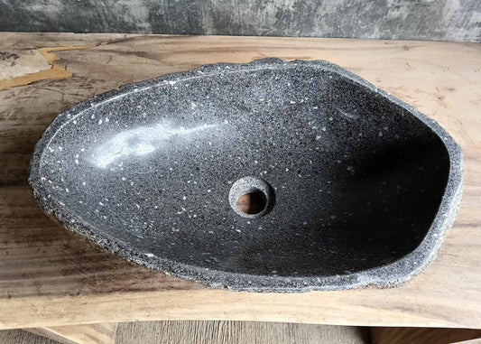 Top view of handcrafted oval dark gray river stone sink SKU 6083-5335 with polished interior and rugged natural exterior texture
