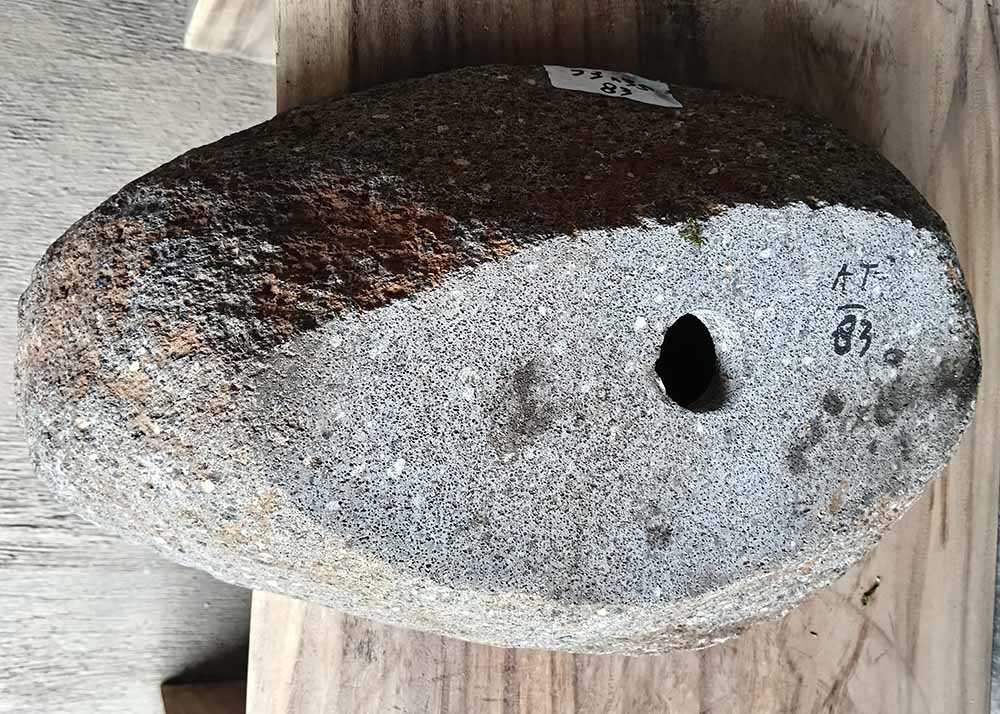 Bottom view showing natural unfinished stone base of handcrafted oval river stone sink SKU 6083-5335
