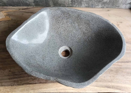 Top view of triangular river stone sink 6093-4937 with polished light gray interior
