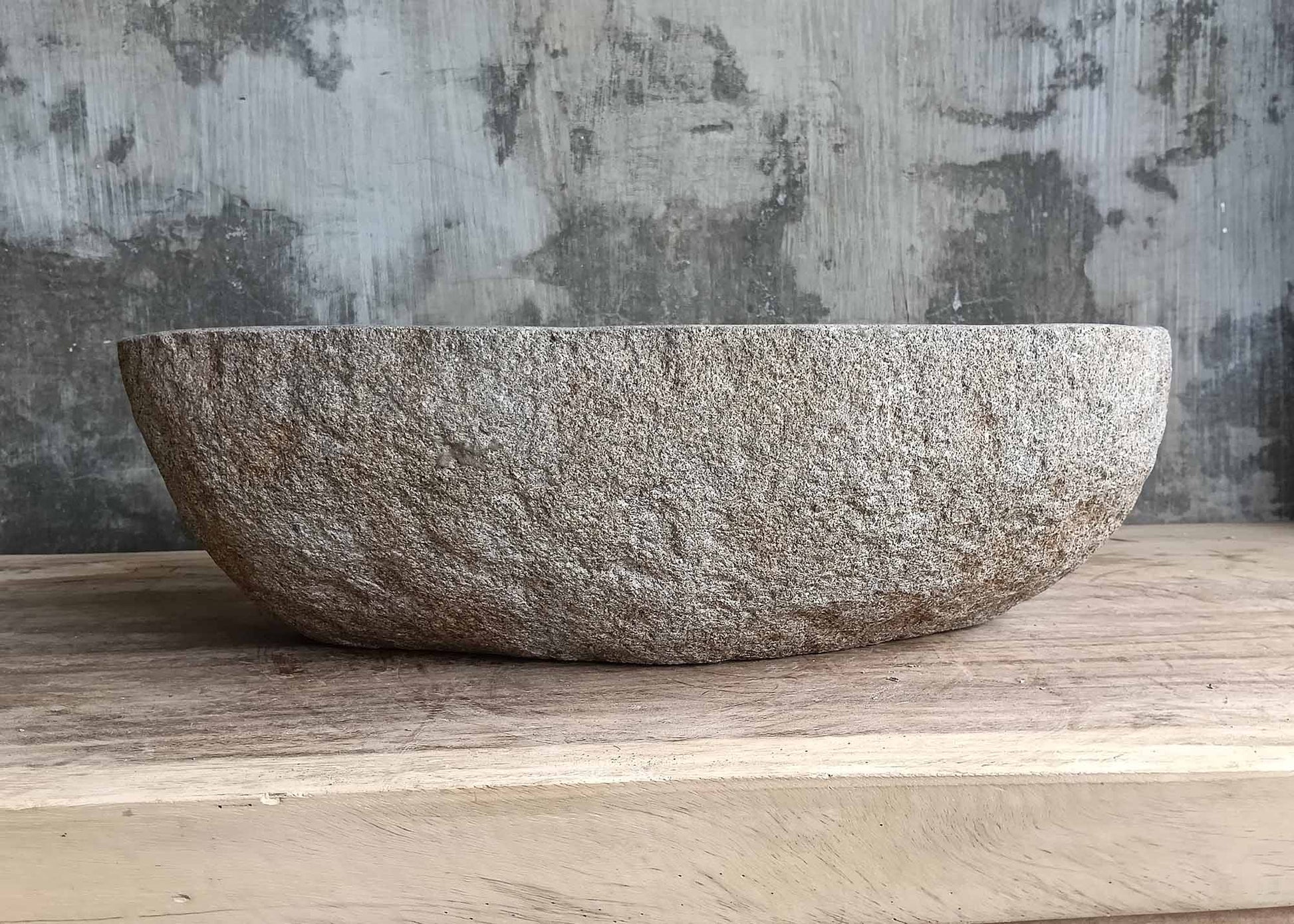 Front view of handcrafted river stone basin 6094-4931 with natural brown shell
