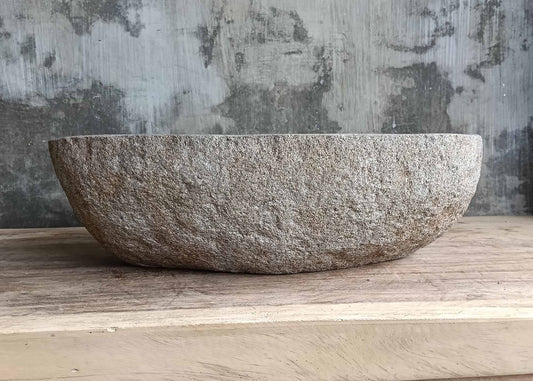 Front view of handcrafted river stone basin 6094-4931 with natural brown shell
