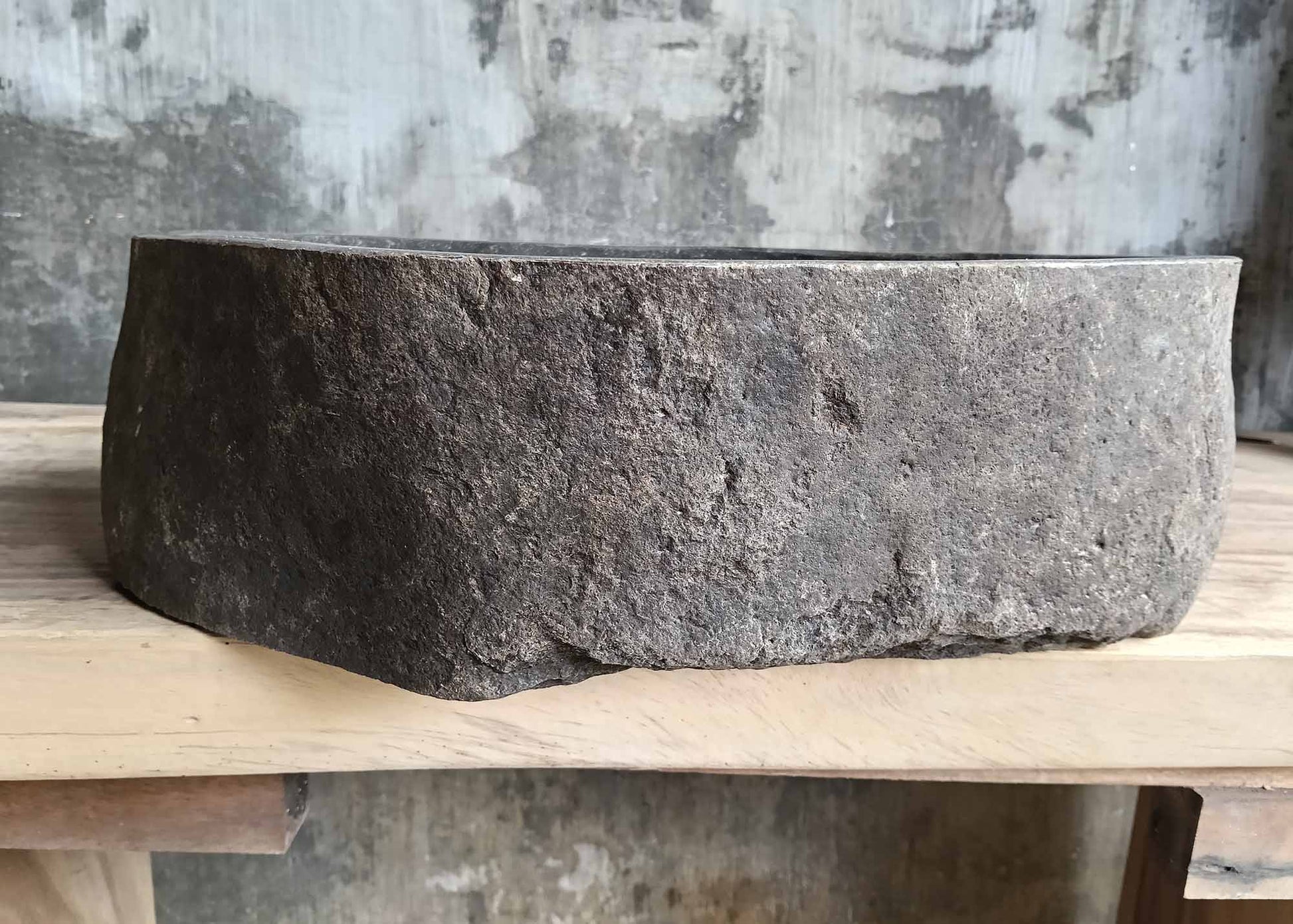 Front angle of handcrafted dark gray stone sink 6096-4732 showing natural texture
