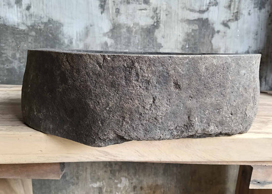 Front angle of handcrafted dark gray stone sink 6096-4732 showing natural texture
