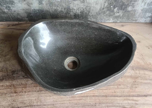 Top view of triangular river stone sink 6096-4732 with deep gray polished interior
