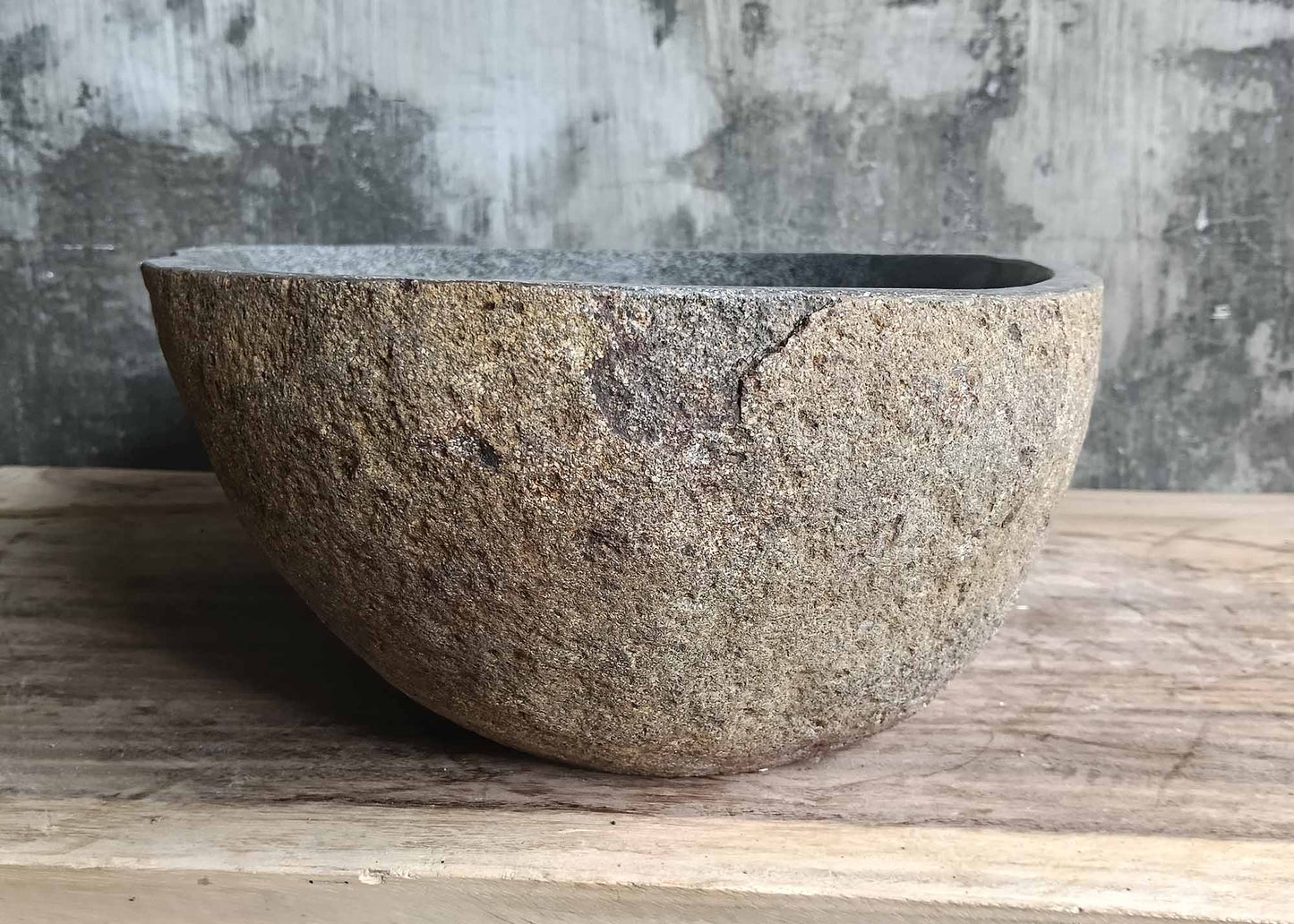 Left side of natural river stone basin 6099-4836 with raw stone finish
