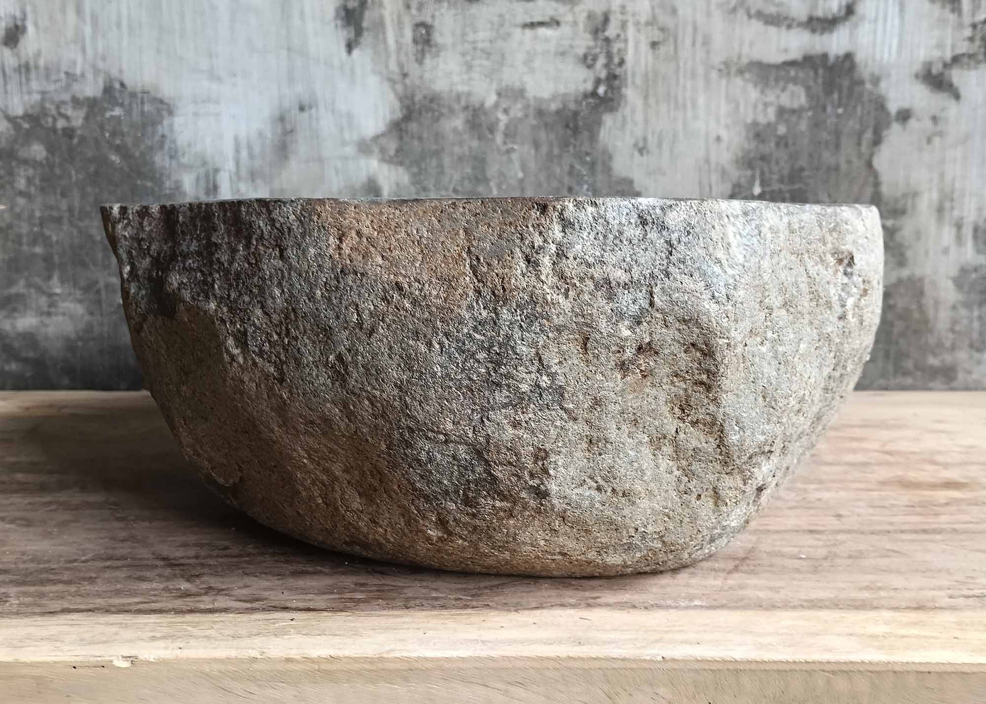 Left side view of river stone basin 6100-4738 with rough stone shell
