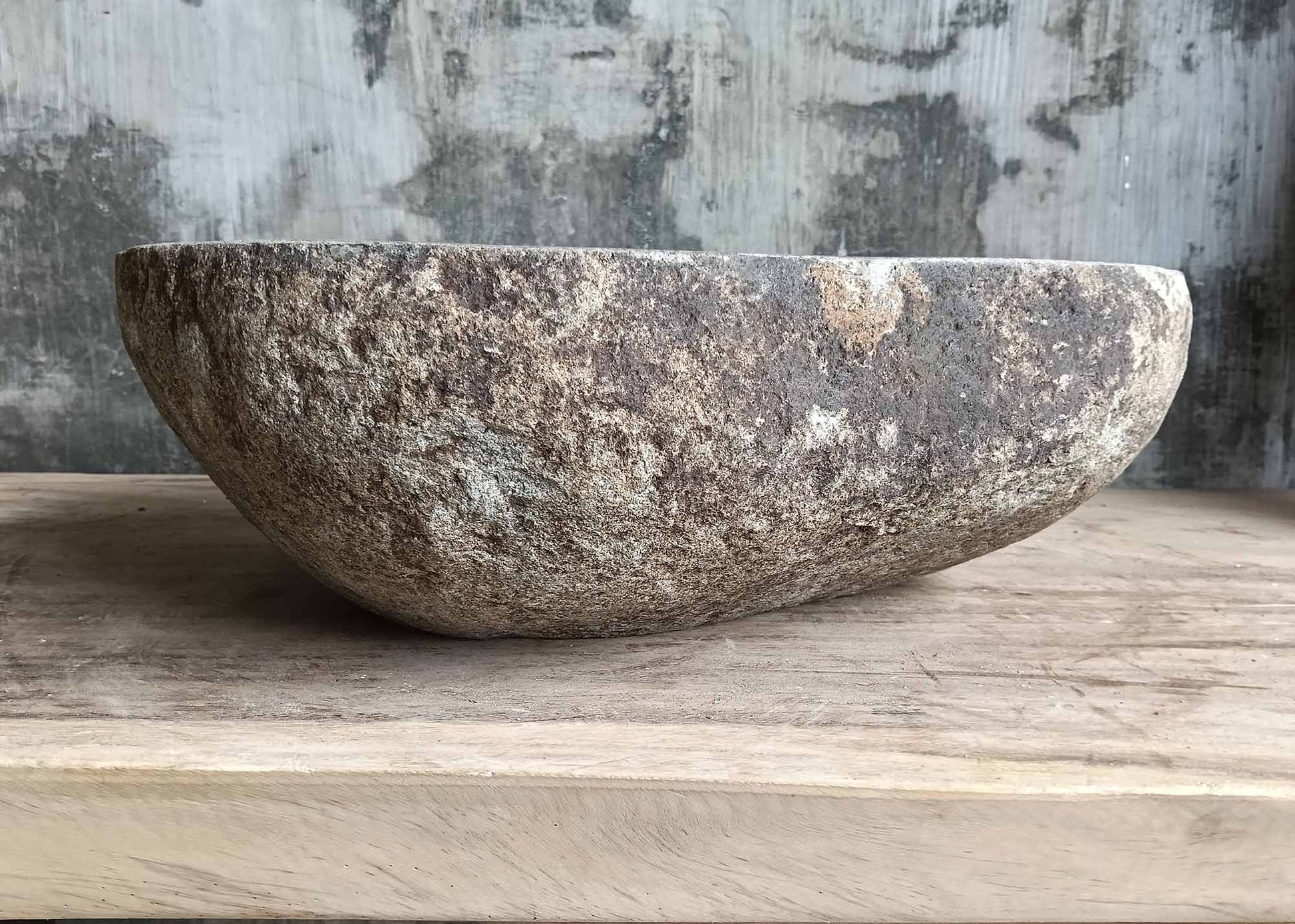 Back side of 6107-4535 river sink with raw brown stone surface
