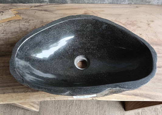 Top view of handcrafted oval dark gray river stone sink SKU 6116-5032 with polished interior and natural rough exterior texture
