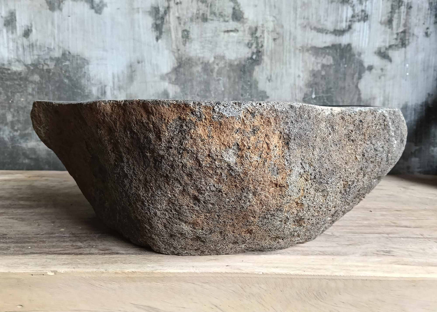 Back side of handcrafted river sink 6118-4533 with rough stone texture
