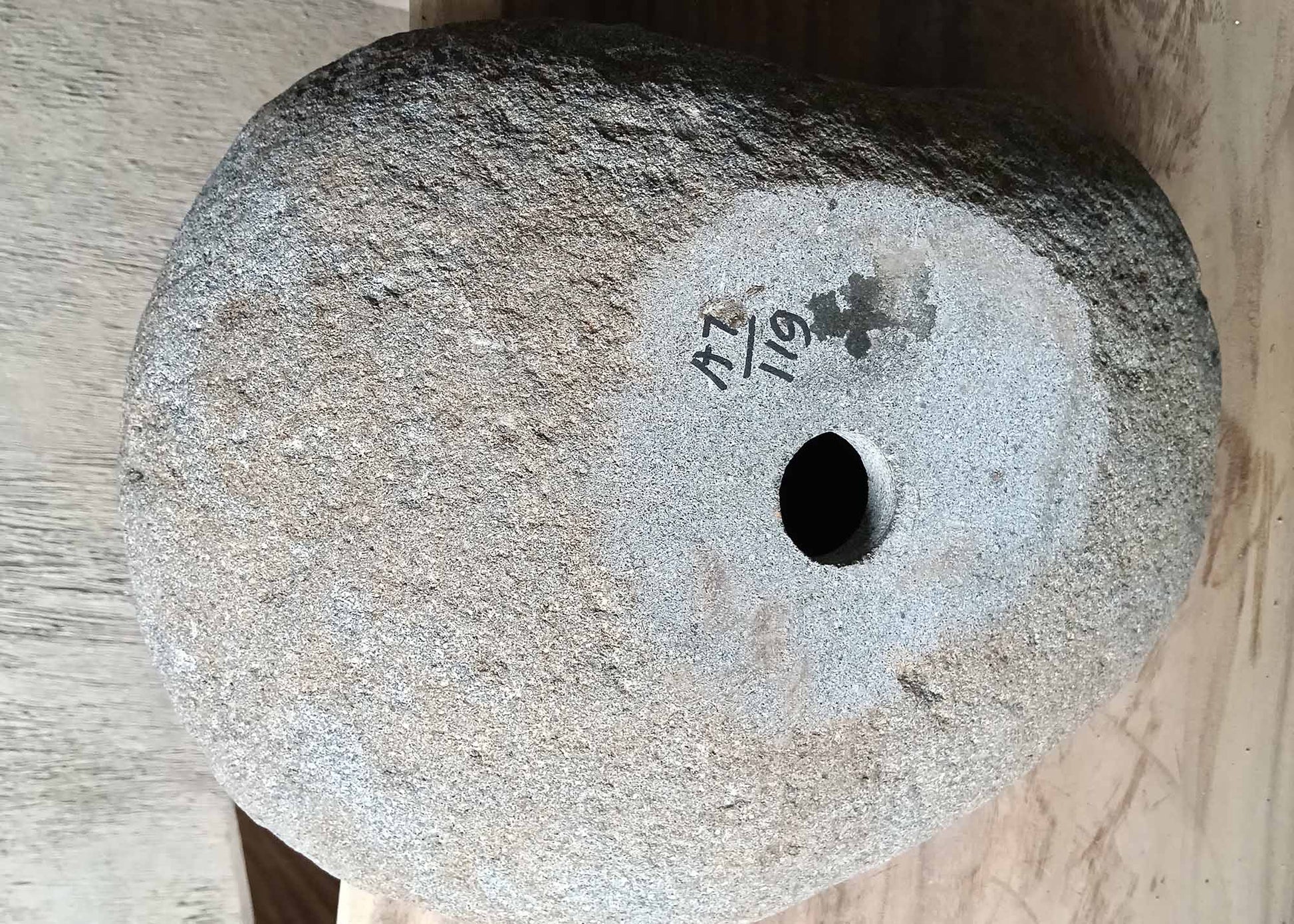 Bottom view of river stone sink 6119-4634 displaying raw stone base
