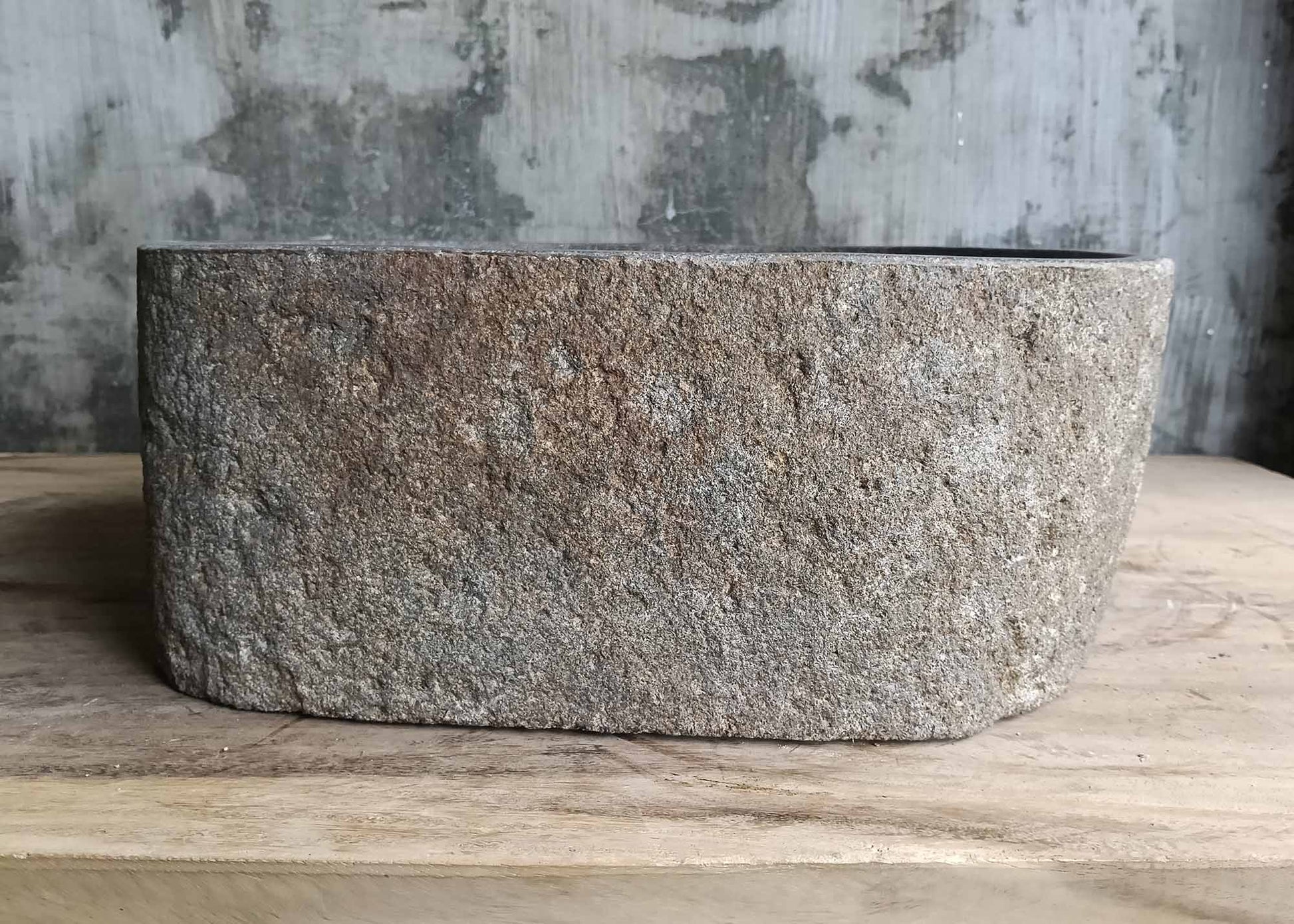 Right side of dark gray rectangular river stone sink 6124-3730 with rough texture
