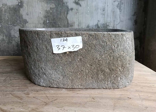 Front side of handcrafted river stone sink 6124-3730 showing textured raw surface
