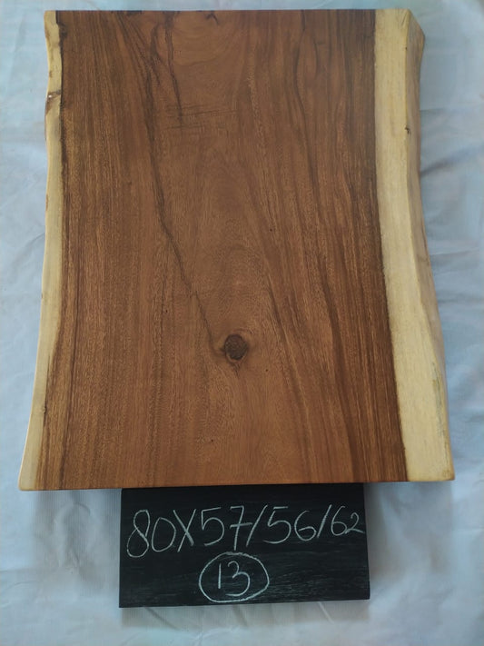 Top view of suar wood slab 0013-575662 with live edge shape and natural brown wood grain, solid single-piece countertop.
