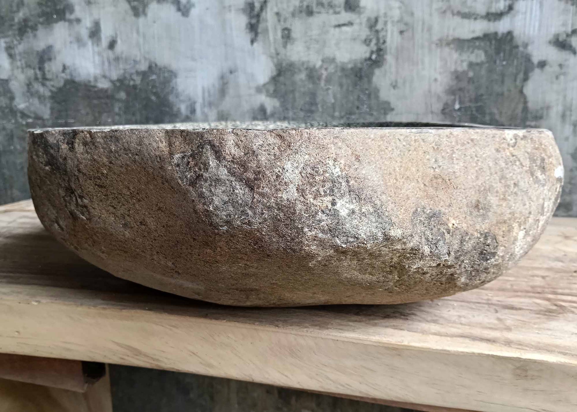 Right side view of river stone sink showing unique stone pattern and natural finish
