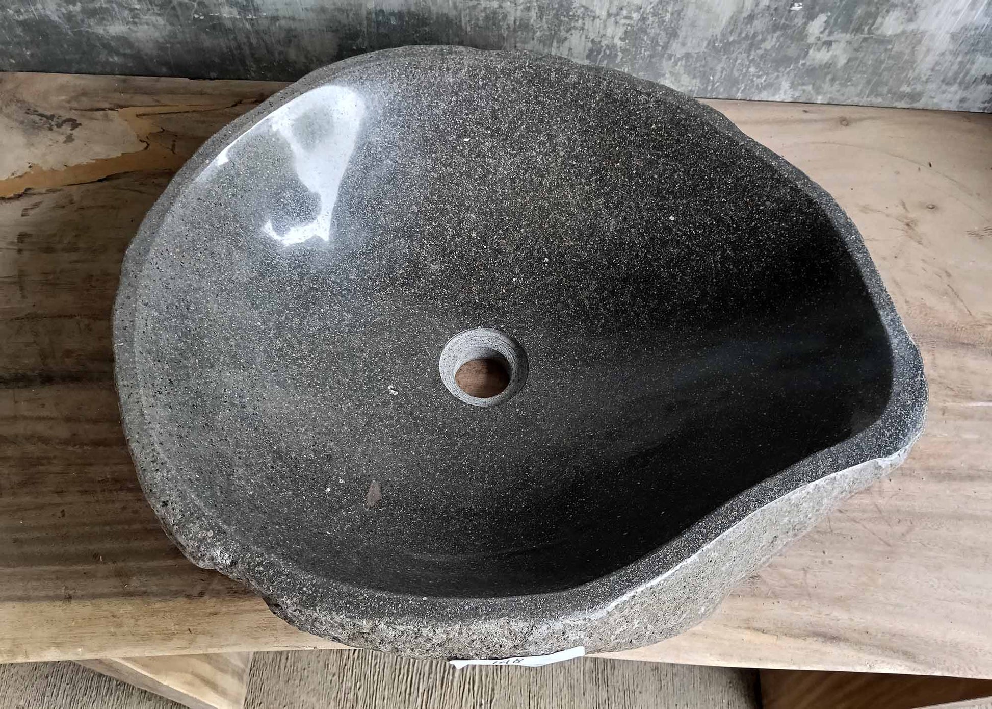 Top view of river stone sink SKU 6148-5247 with polished dark granite interior and natural uneven edges
