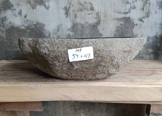 Front view of handcrafted river stone sink SKU 6148-5247 showing rugged natural stone exterior and smooth polished dark interior
