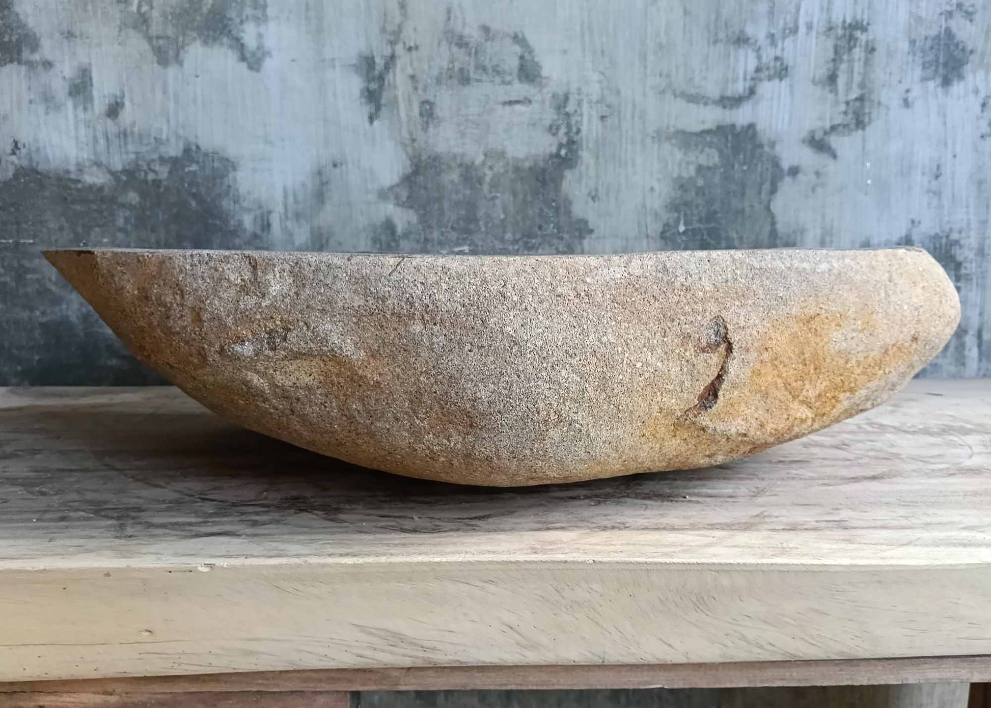 Right side of stone sink SKU 6149-5934 with rugged surface and smooth top edge
