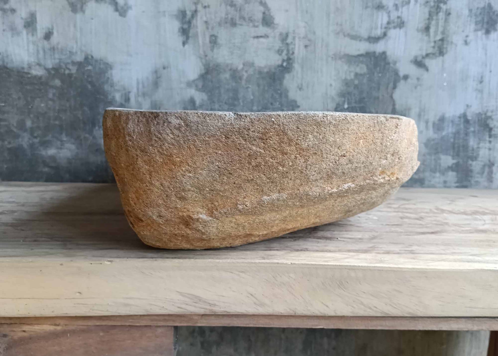 Left side of river stone sink SKU 6149-5934 showing raw granite texture and dark polished interior
