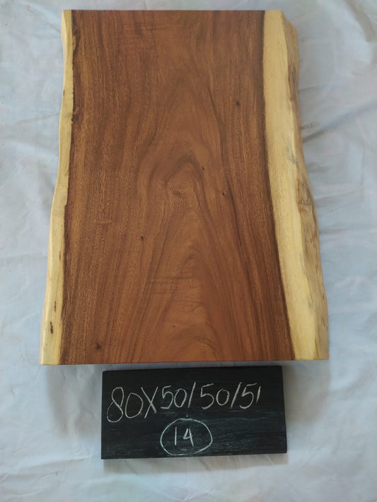 Top view of suar wood slab 0014-505051 with live edge shape and warm brown natural wood grain, solid single-piece countertop.
