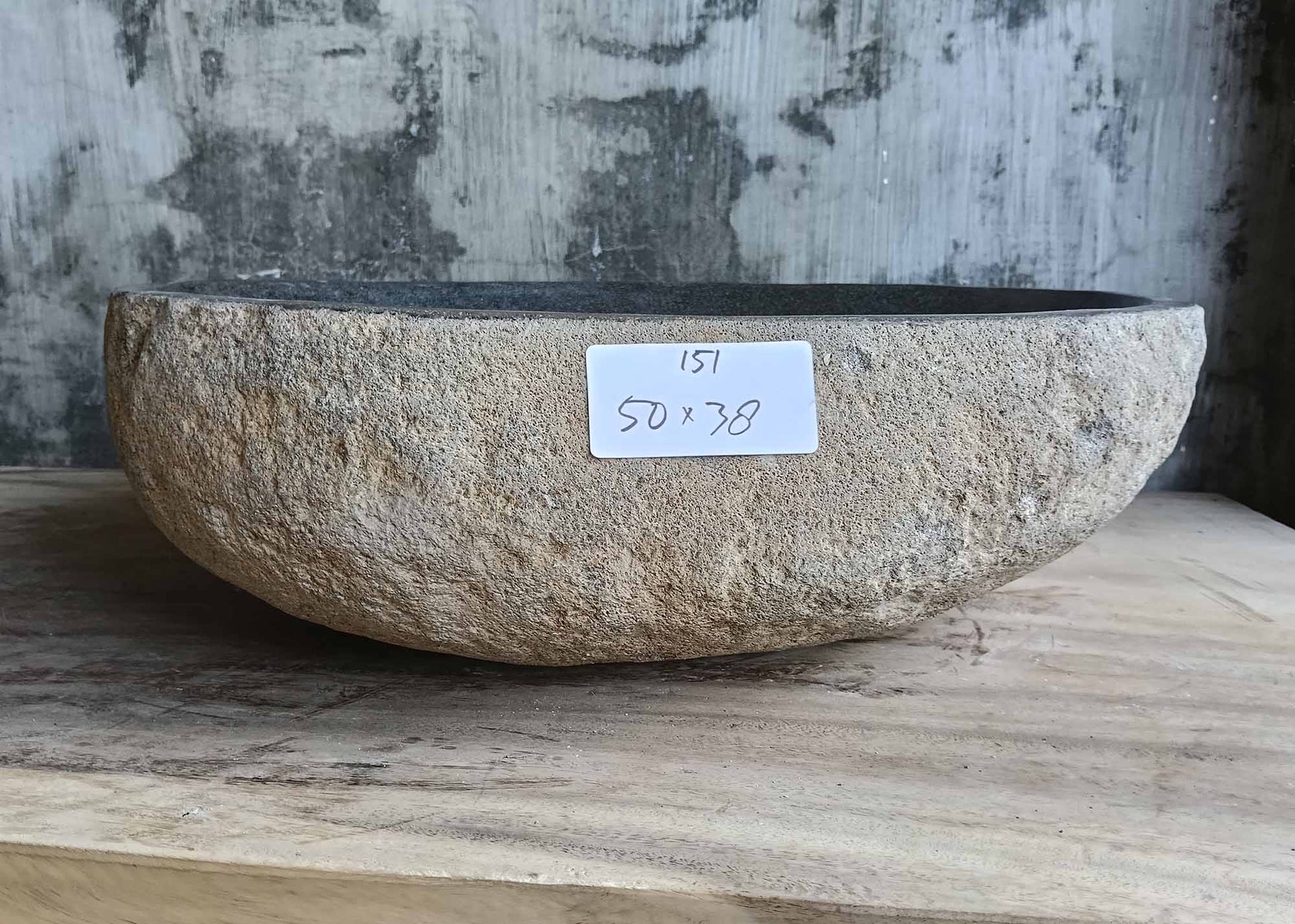 Front view of handcrafted river stone sink SKU 6151-5038 showing beige granite exterior and raw texture
