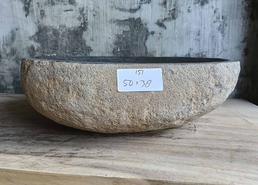 Front view of handcrafted river stone sink SKU 6151-5038 showing beige granite exterior and raw texture
