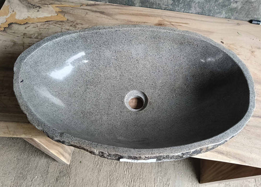 Top view of river stone sink SKU 6155-5836 with polished gray granite interior and natural oval shape
