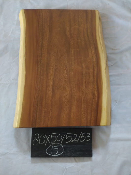 Top view of suar wood slab 0015-505253 with live edge shape and warm brown natural wood grain, solid single-piece countertop.
