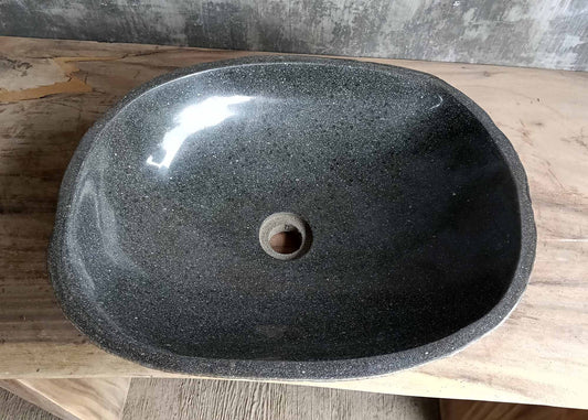 Top view of river stone sink SKU 6160-5141 with deep polished dark granite interior and oval shape
