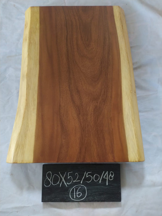 Top view of suar wood slab 0016-525048 with live edge shape and warm brown natural wood grain, solid single-piece countertop.
