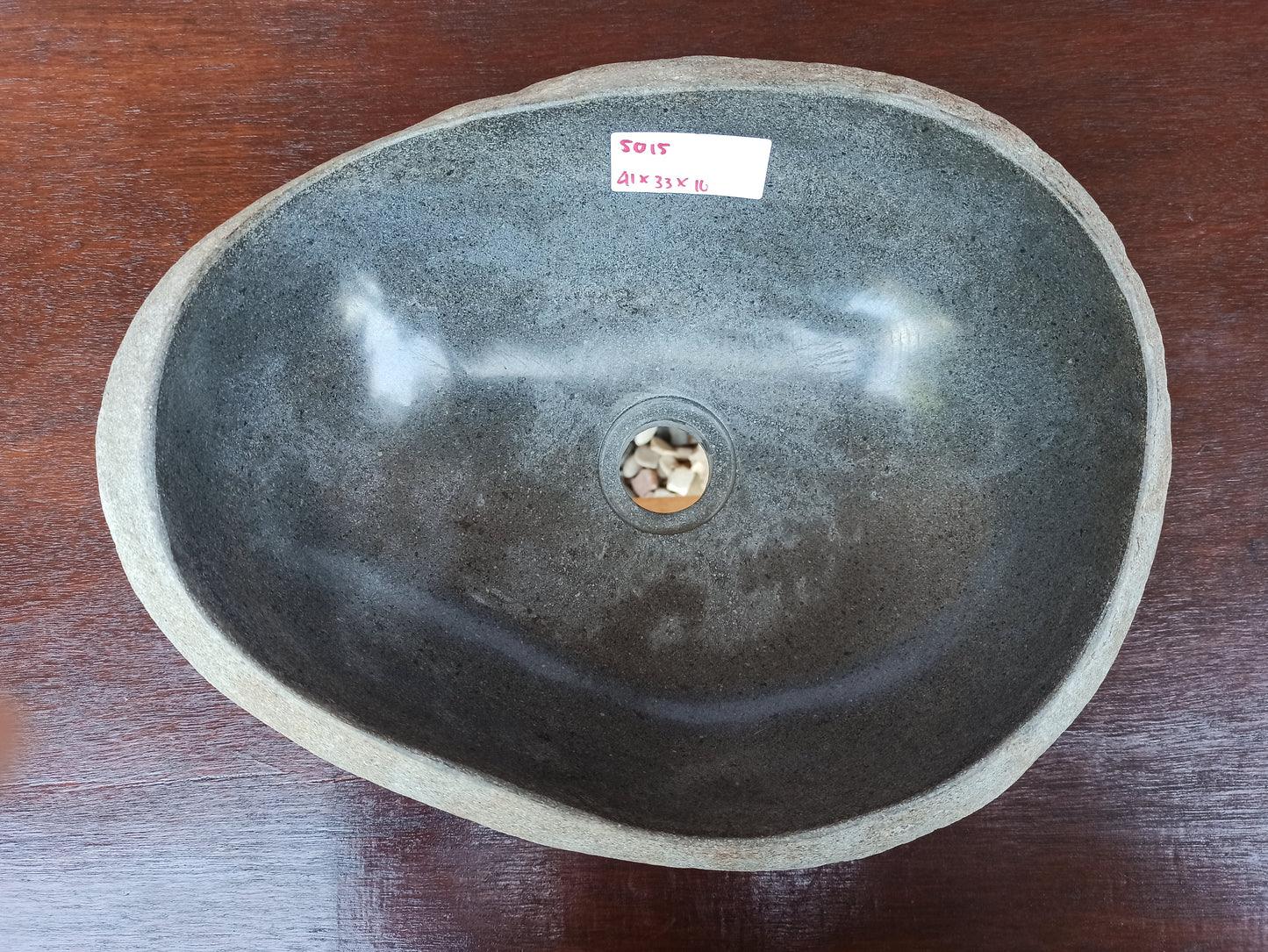 Top view of 5015-413316 charcoal gray river stone sink — polished elongated oval interior

