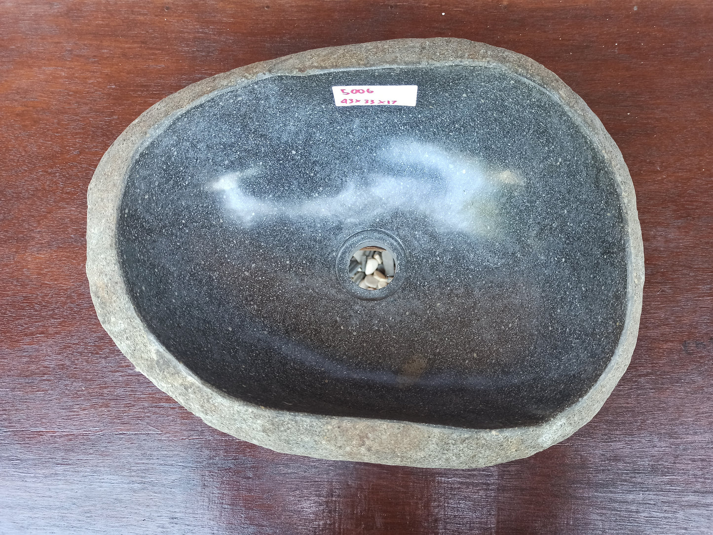 Top view of 5006-433317 charcoal gray river stone sink — polished oval interior
