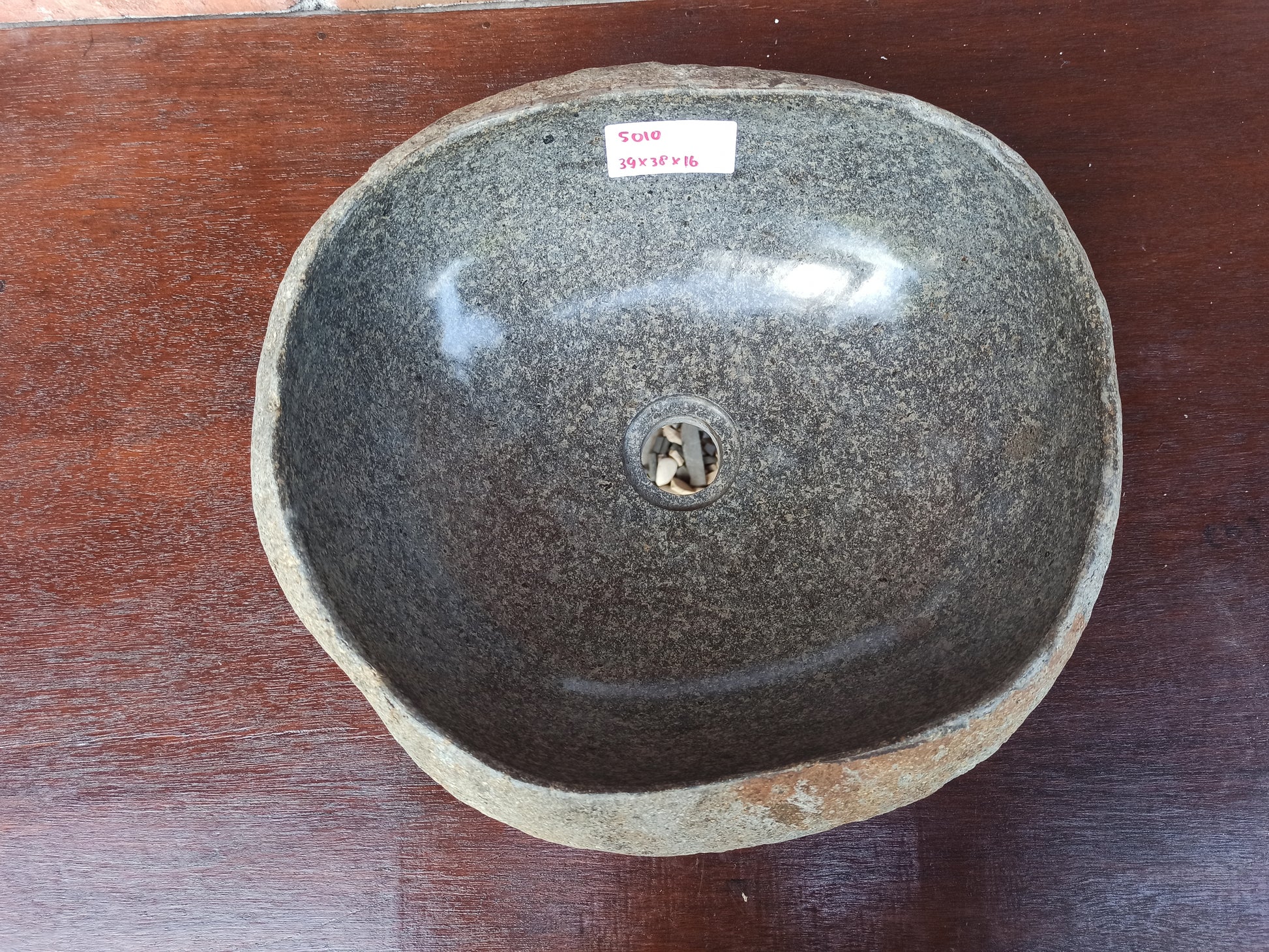 Top view of 5010-393816 smoky gray river stone sink — polished oval interior
