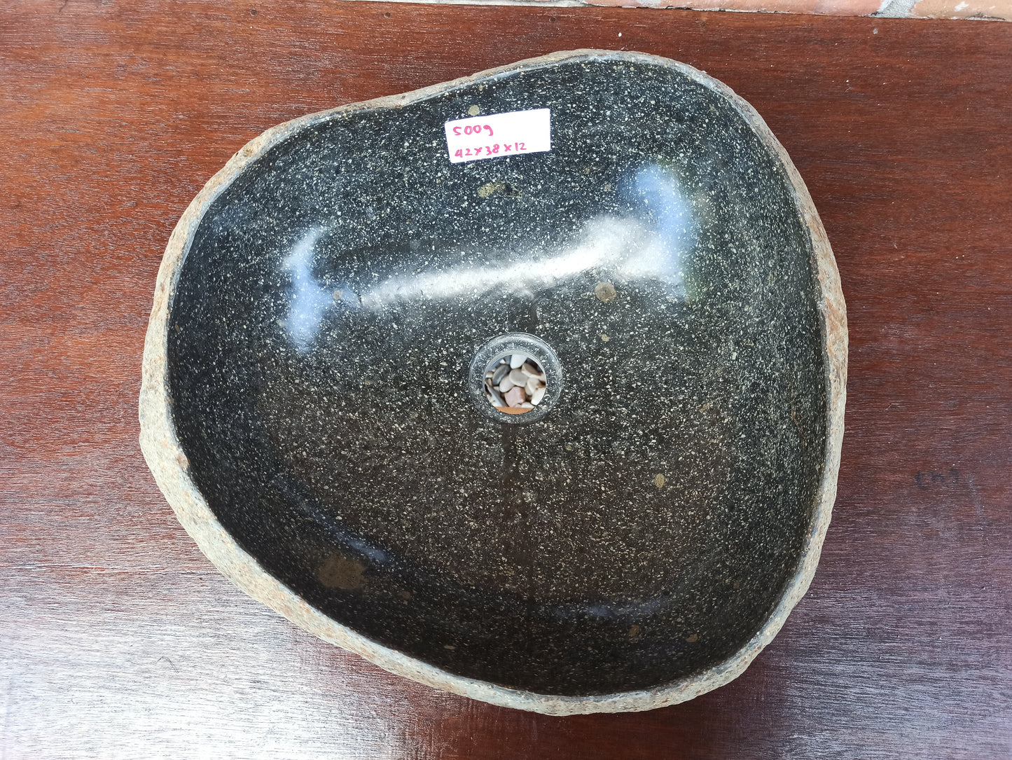 Top view of 5009-423812 black river stone sink — polished interior, organic oval shape
