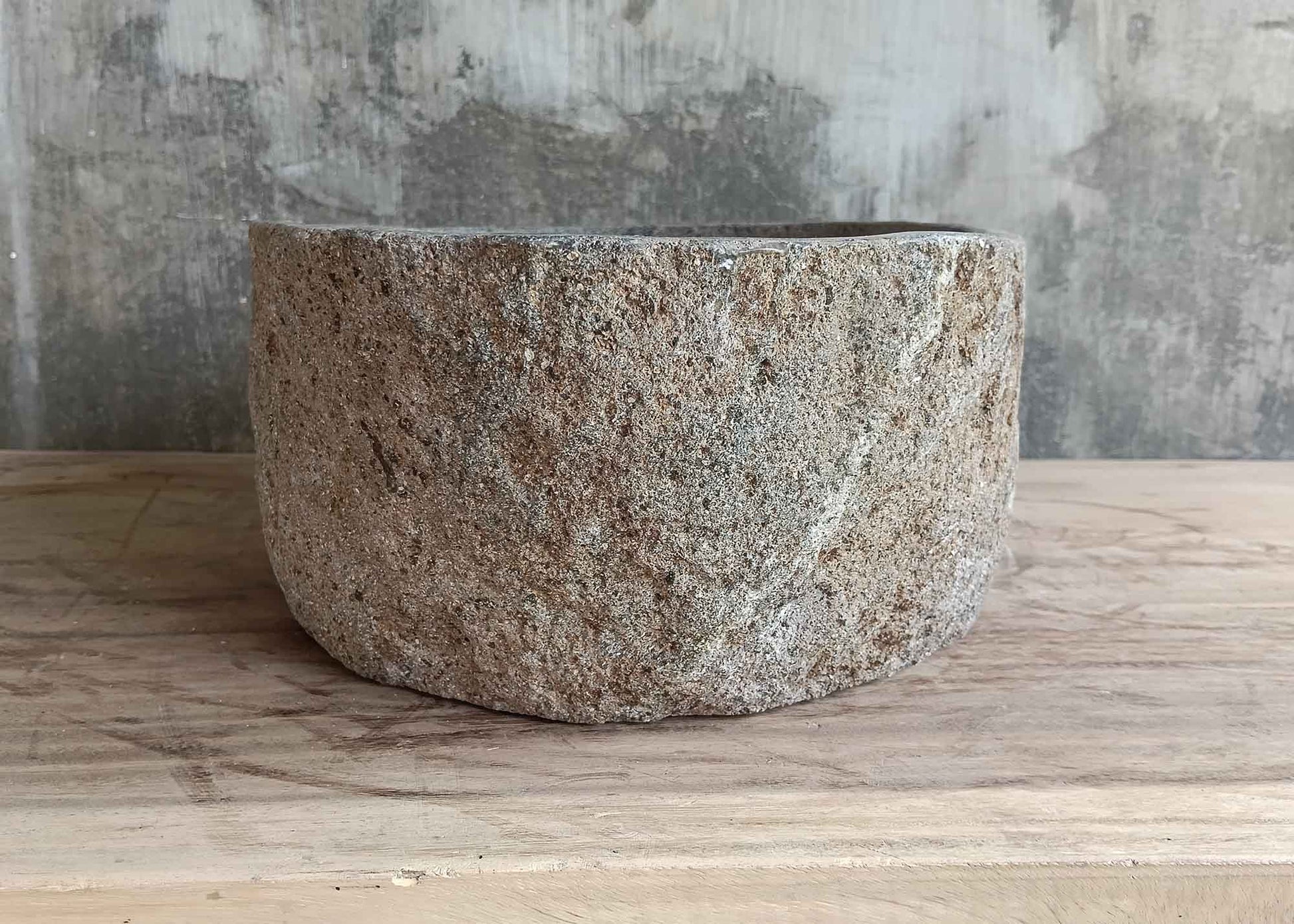 Back view of 16×12 inch oval gray river stone sink with natural texture and clean lines
