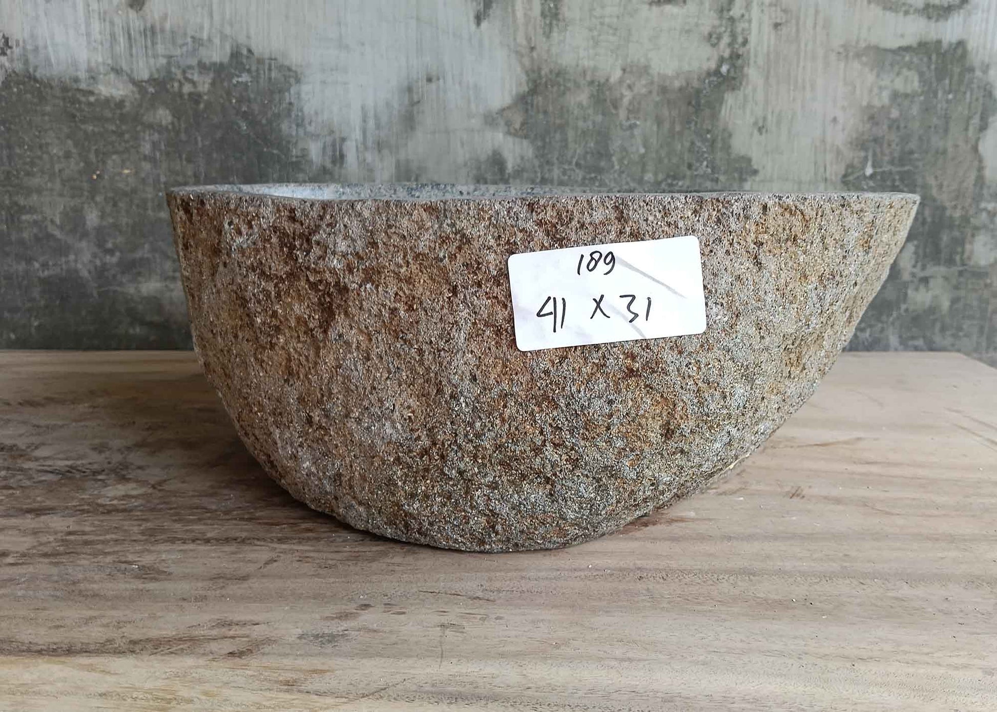 Right side of 16×12 inch river stone sink showing stone grain and boat contour
