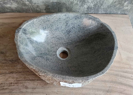 Top view of 16×12 inch gray river stone sink with interior swirls and oval shape
