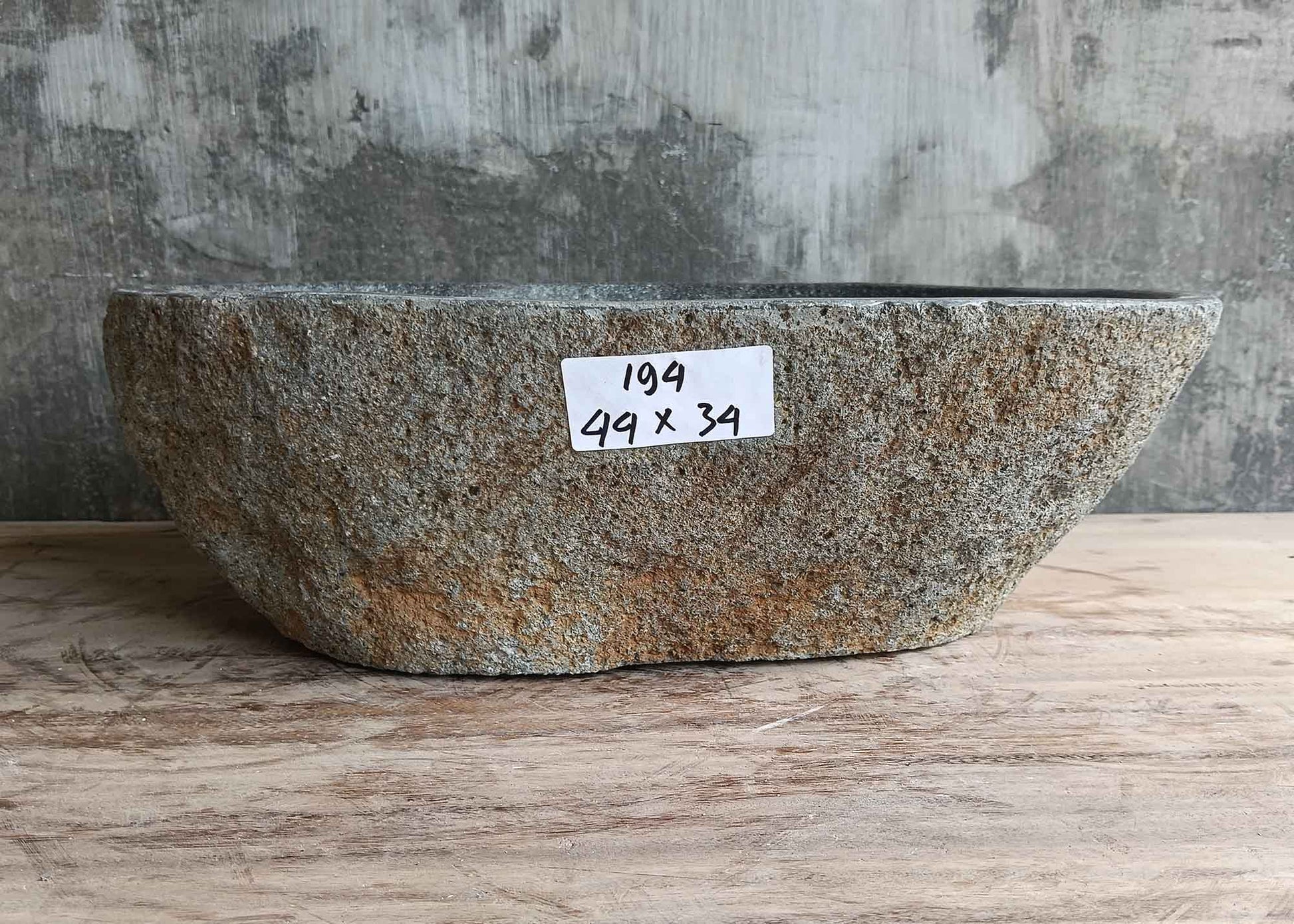 Front view of gray river stone sink 17×13 inch with natural uneven edge and boat-like curve
