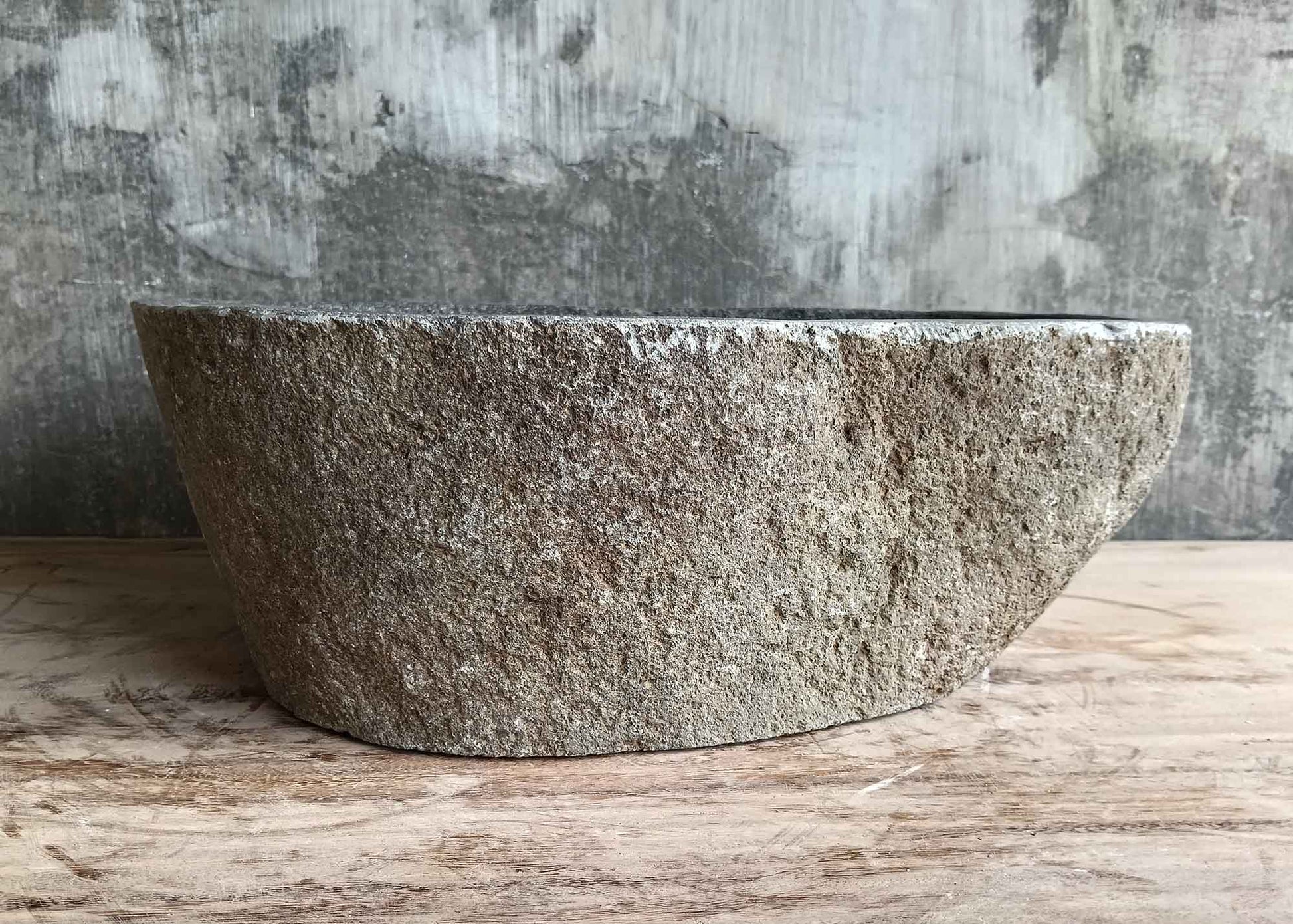 Back side of 17×13 inch gray river stone sink showing textured surface and irregular contour
