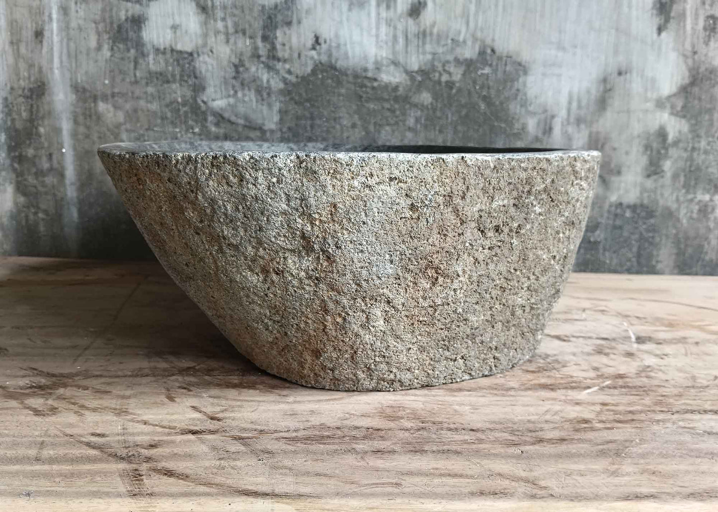 Right side of 17×13 inch gray river stone sink showing organic form and rough exterior
