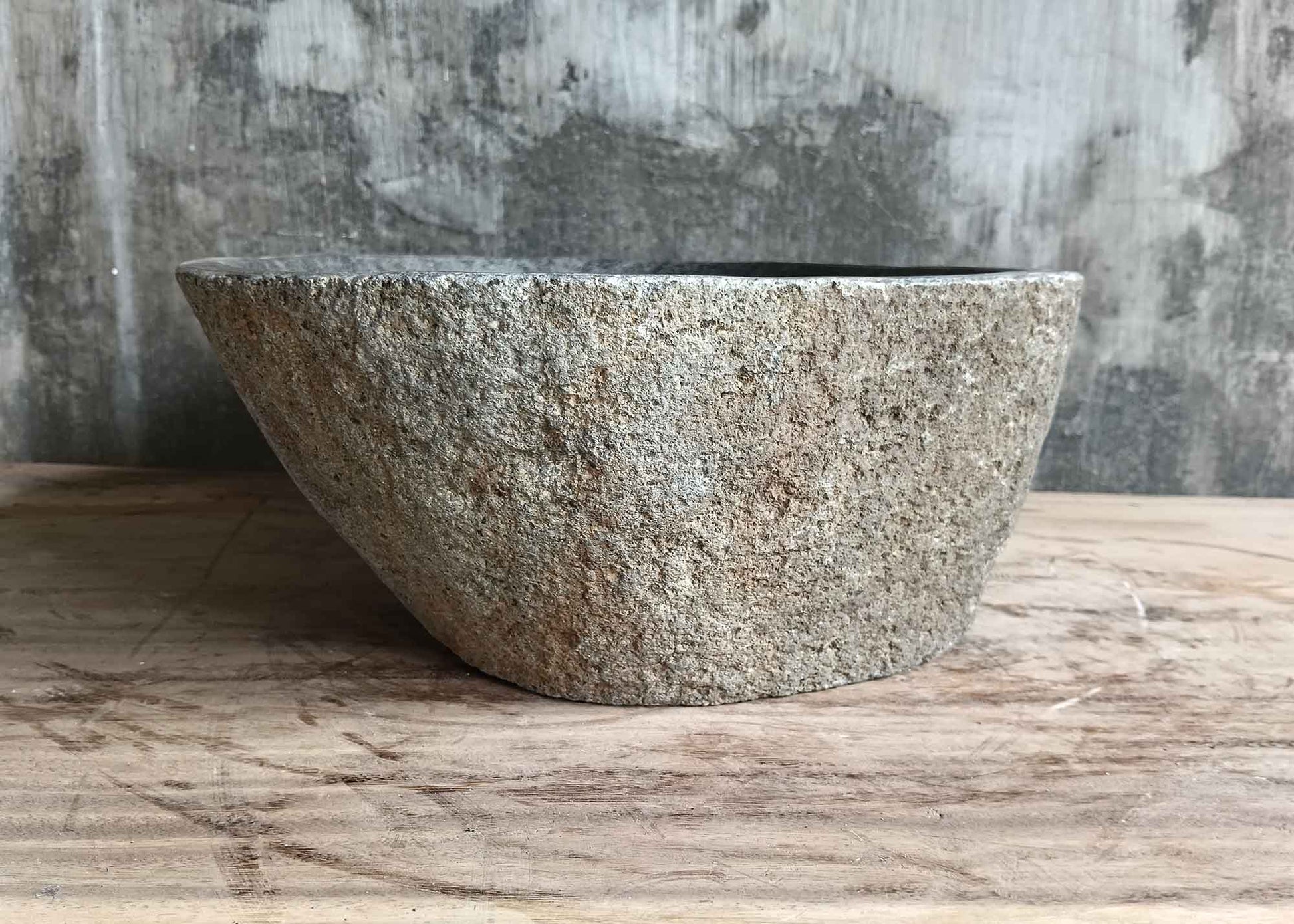Right side of 17×13 inch gray river stone sink showing organic form and rough exterior
