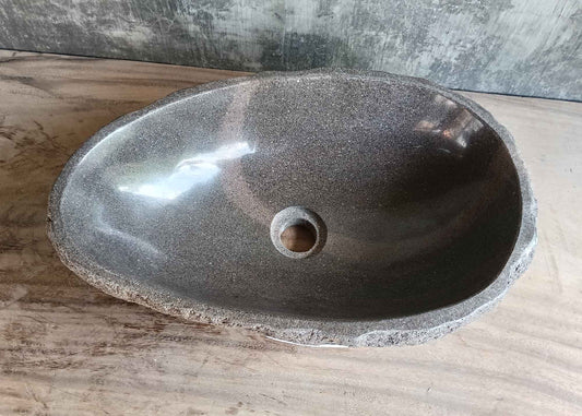 Top view of 18×12 inch handcrafted brown river stone sink with oval shape
