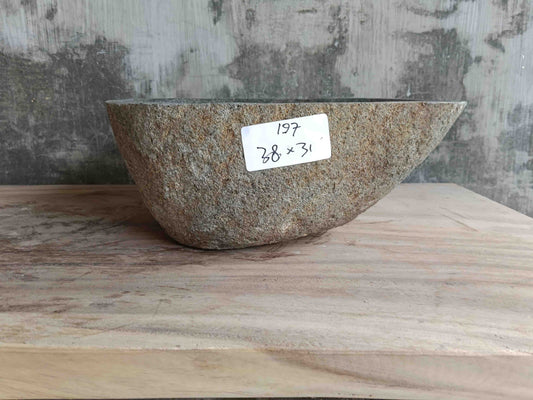 Side view of 15×12 inch grey river stone sink installed in countertop
