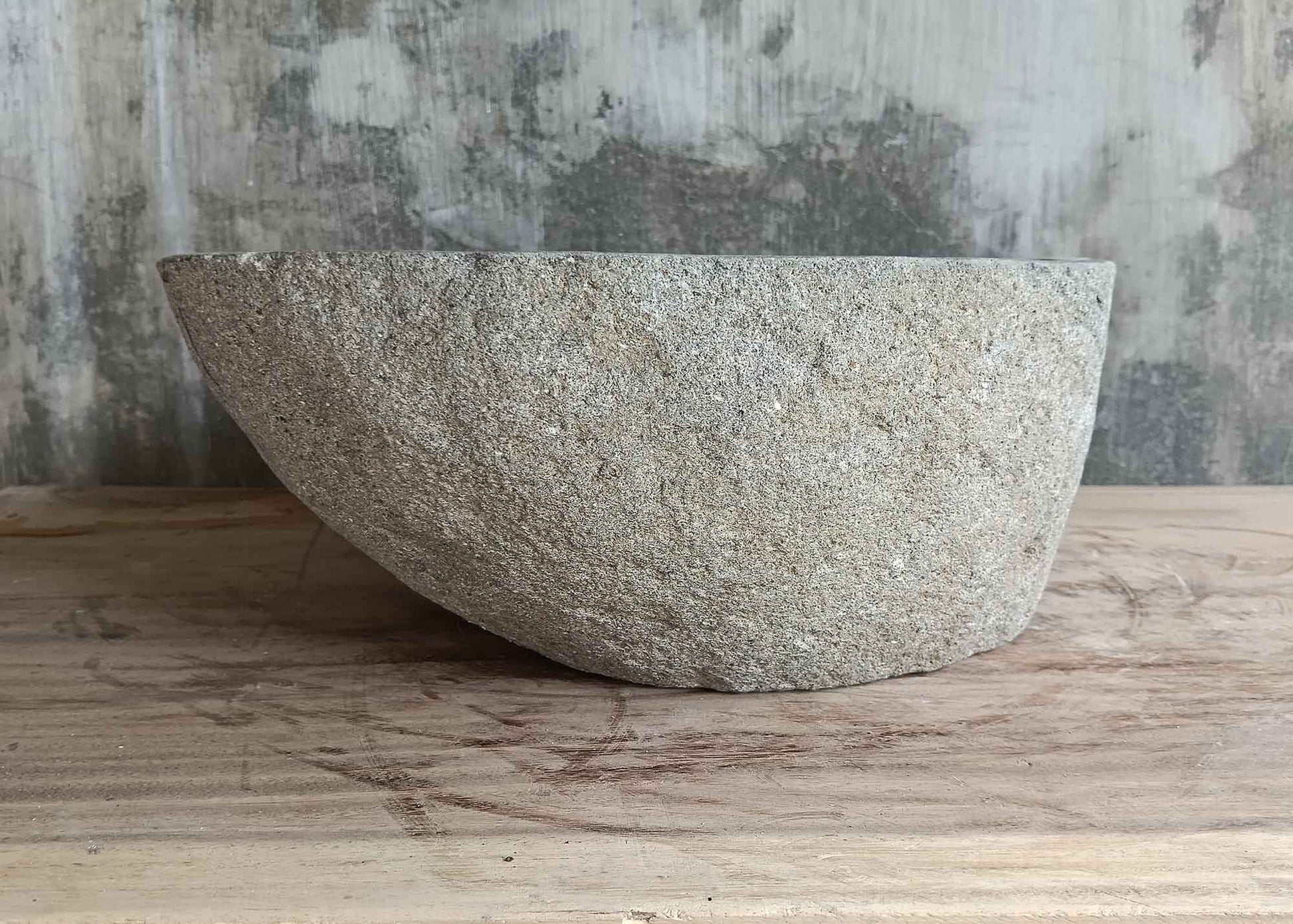 Back side of 17×14 inch sink showing gray raw stone and vertical form
