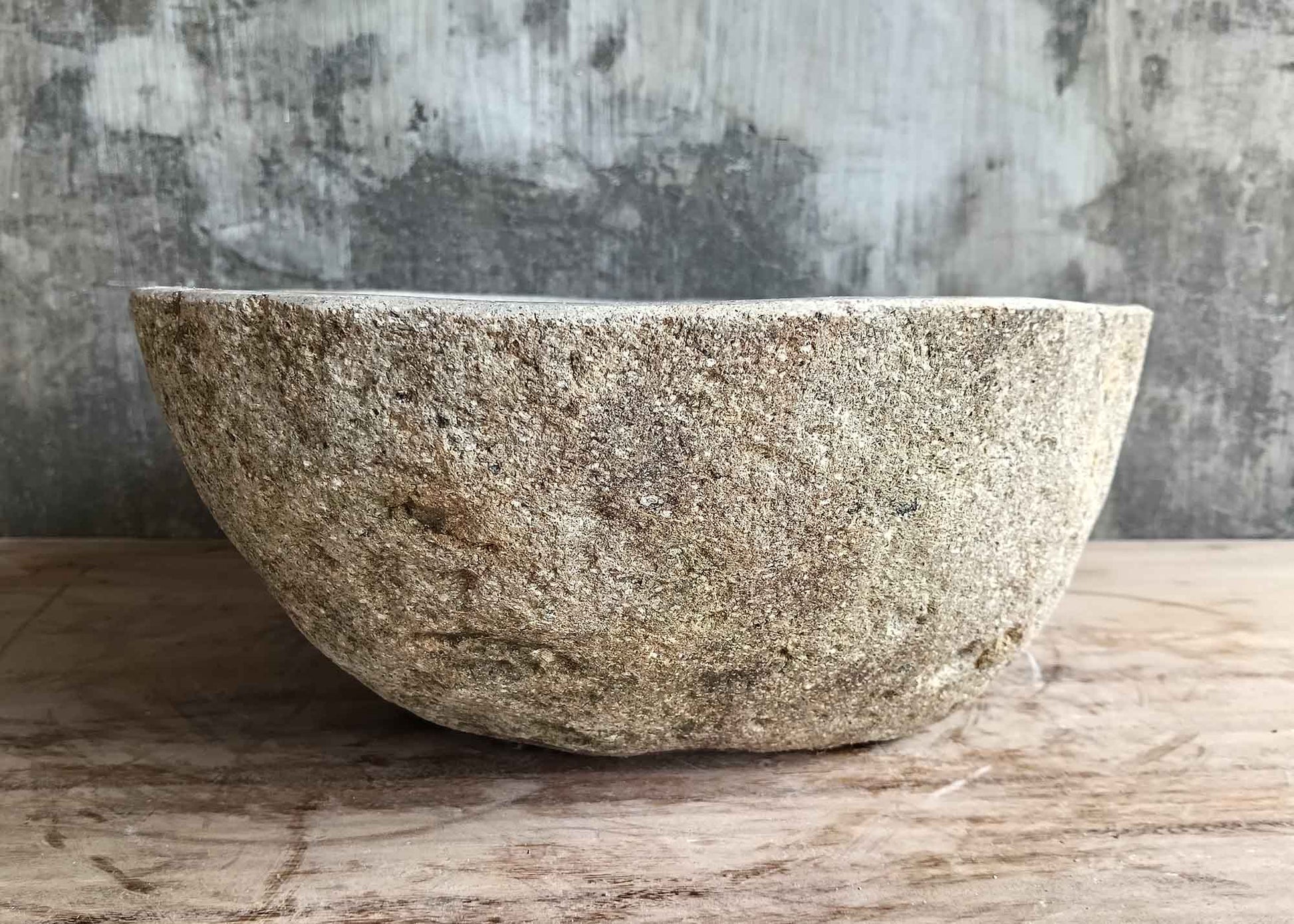 Right side view of light 17×14 inch stone sink showing polished interior and raw surface
