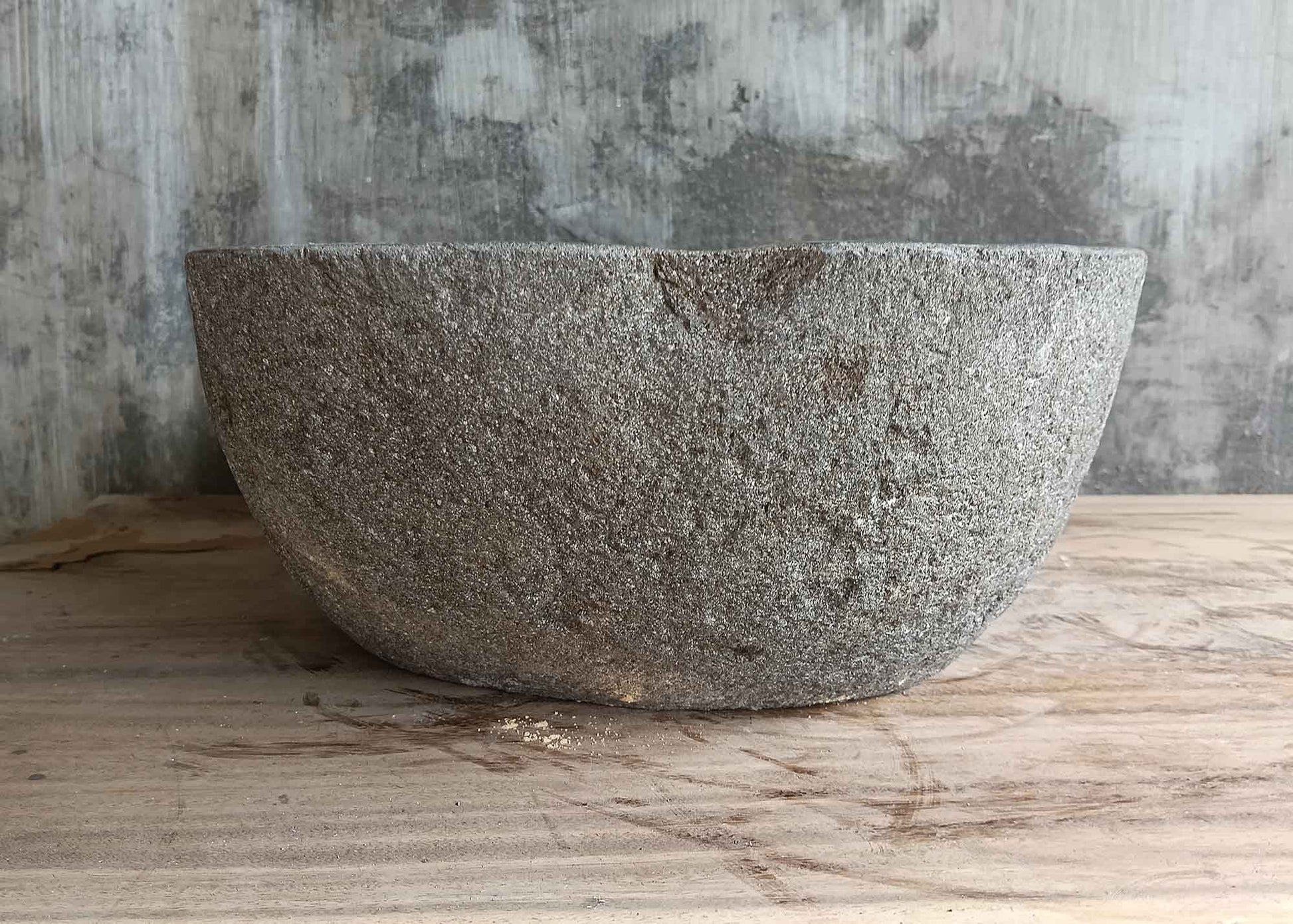 Left side of 18×13 inch river stone sink showing vertical edge and rear rise
