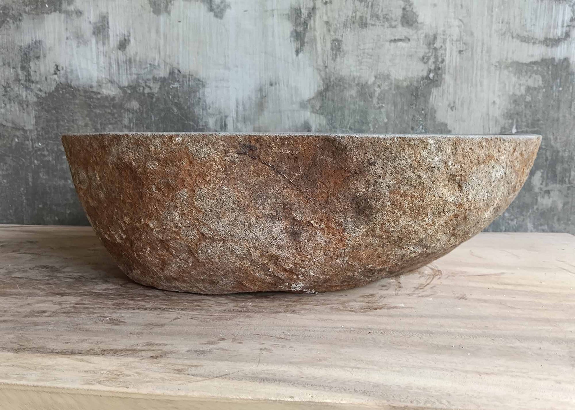 Back side of 18×14 inch gray river stone sink showing organic triangular-oval blend
