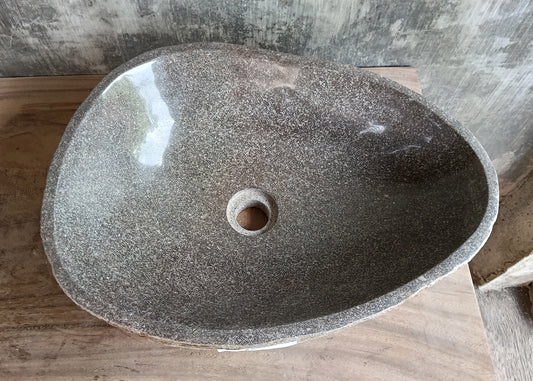 Top view of 18×14 inch gray river stone sink with oval-triangular shape and polished interior
