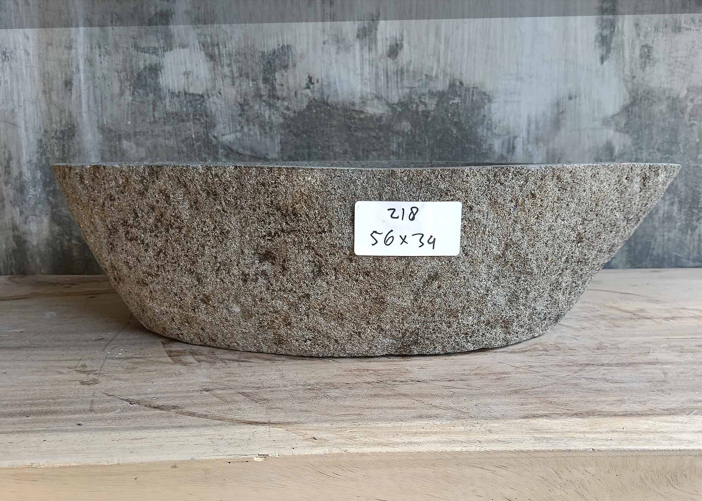 Front view of river stone sink SKU 6218-5634 with textured brown outer shell and tapered profile
