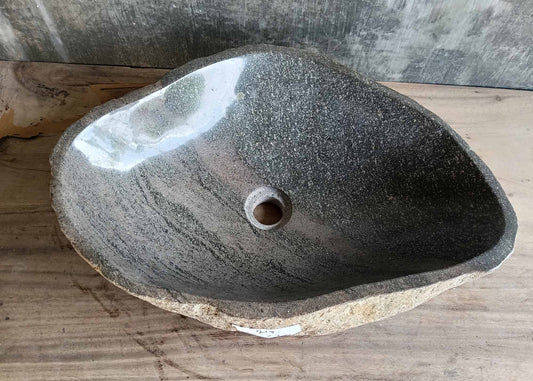 Handcrafted triangular river stone sink 6219-5538 with deep-polished dark gray interior and soft mineral lines
